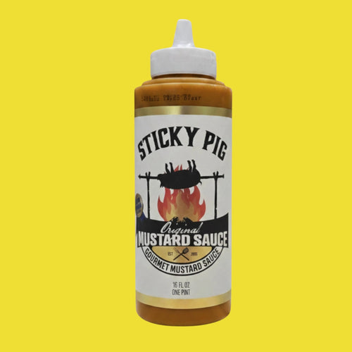 Sticky Pig BBQ Original Mustard Sauce in a 16-ounce squeeze bottle with a yellow background.