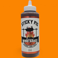 Sticky Pig BBQ Original Gourmet Wing Sauce in a 16-ounce squeeze bottle with a white cap against an orange background.