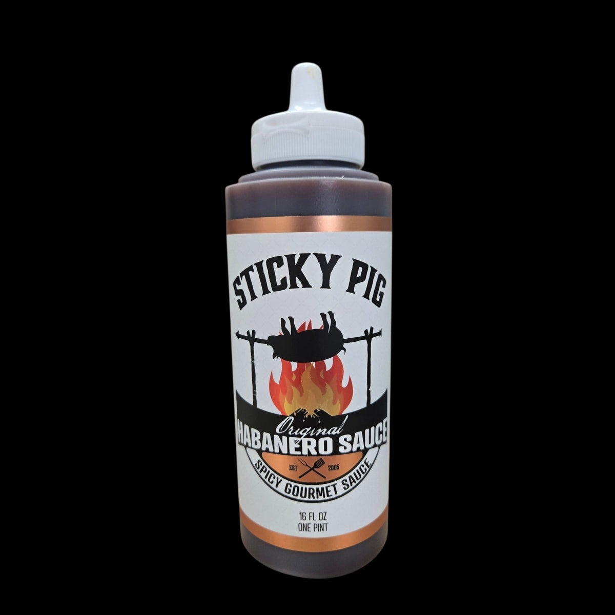 Sticky Pig BBQ Original Habanero gourmet spicy barbecue sauce in a 16-ounce squeeze bottle with a black background.