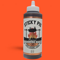 Sticky Pig BBQ Original Habanero gourmet spicy barbecue sauce in a 16-ounce squeeze bottle with a white cap.