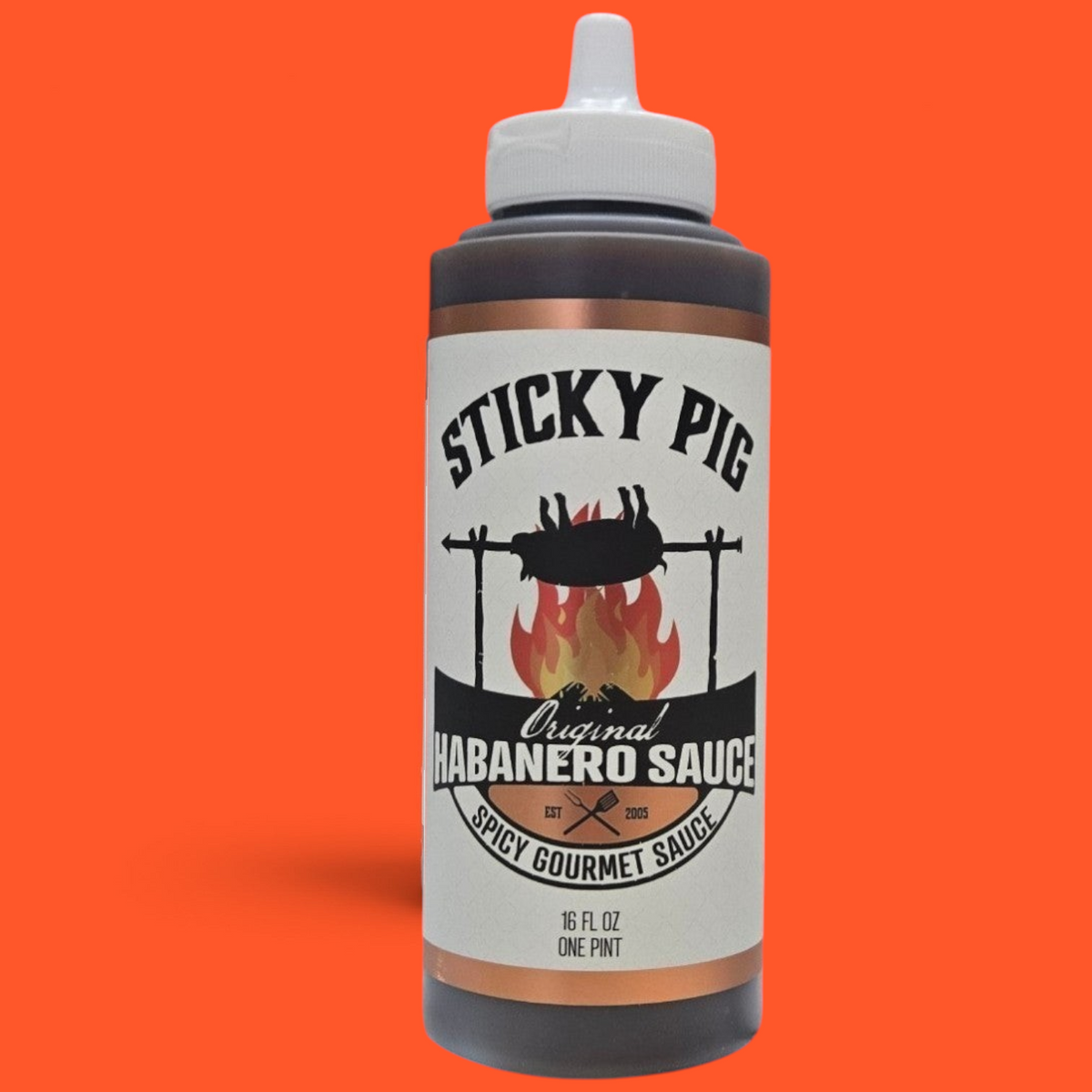 Sticky Pig BBQ Original Habanero gourmet spicy barbecue sauce in a 16-ounce squeeze bottle with a white cap.